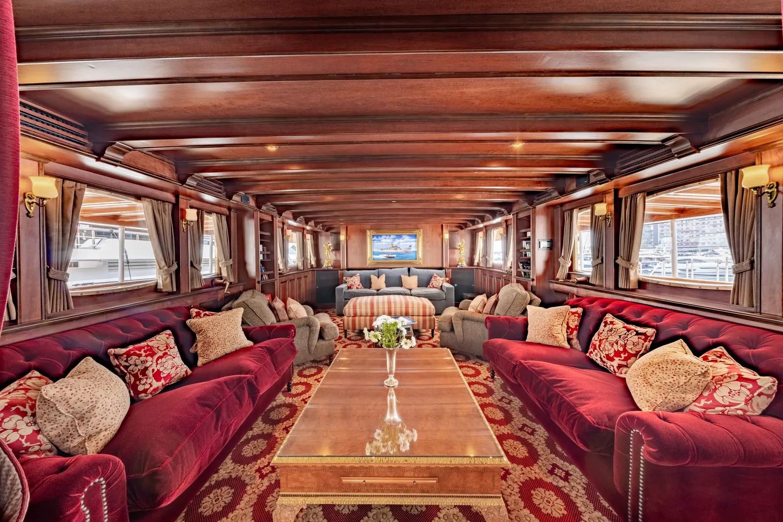 The Delphine Lounge, with deep red seating either side of a long low table.