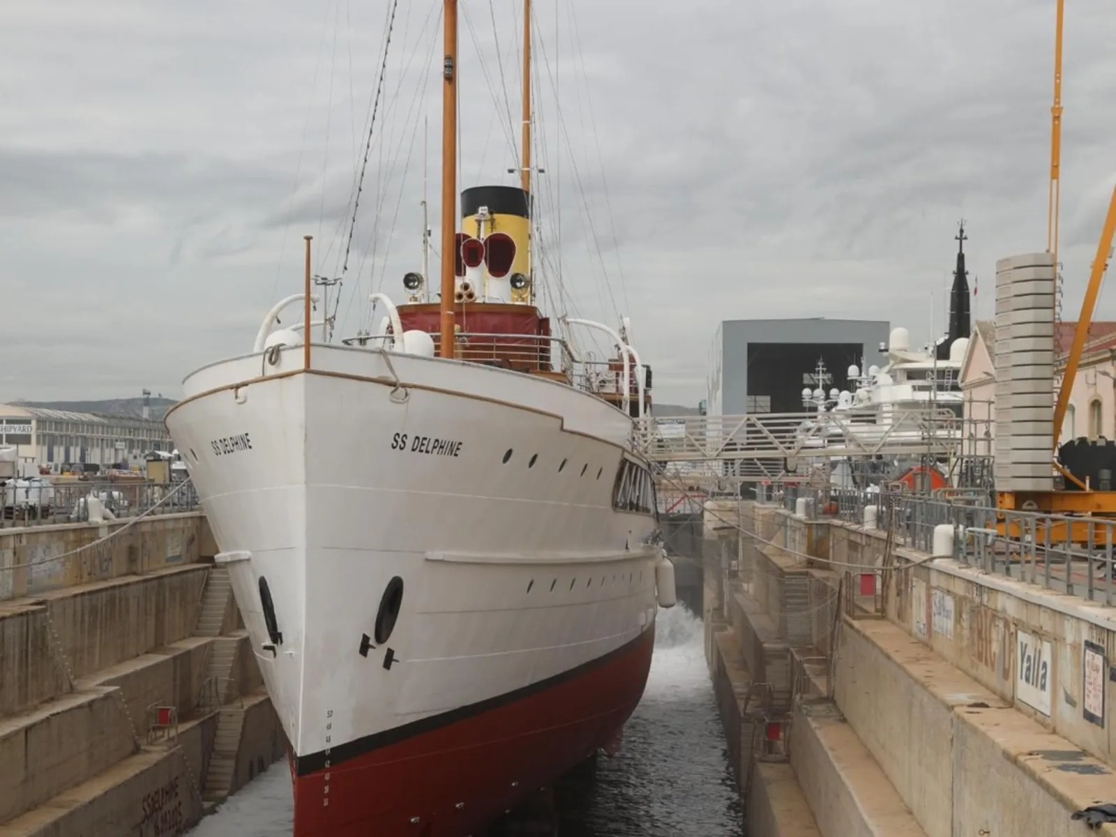 The full length of SS Delphine in the flooded dry dock.