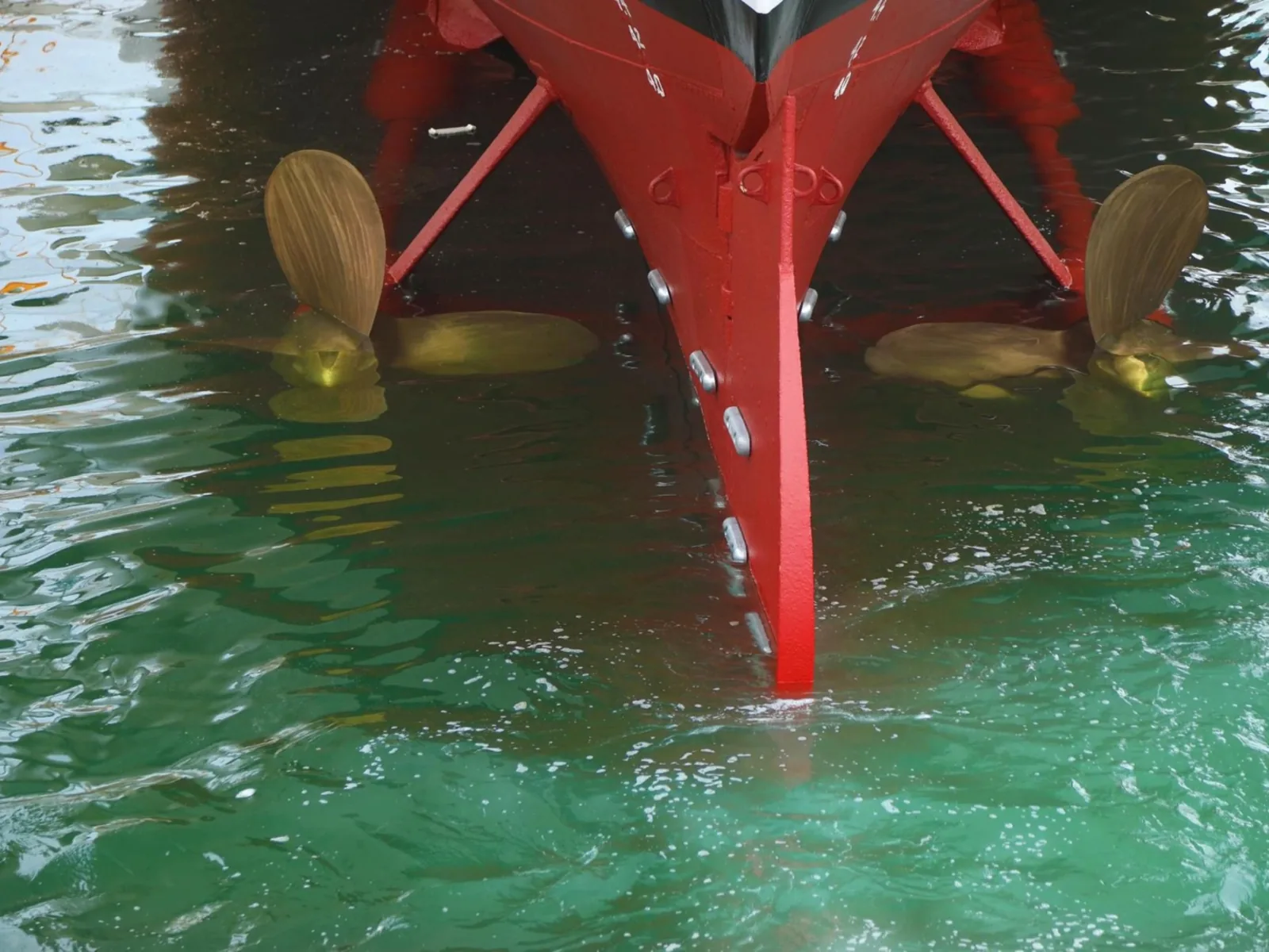 The stern and propellers of SS Delphine as the dock floods and she returns to the water.