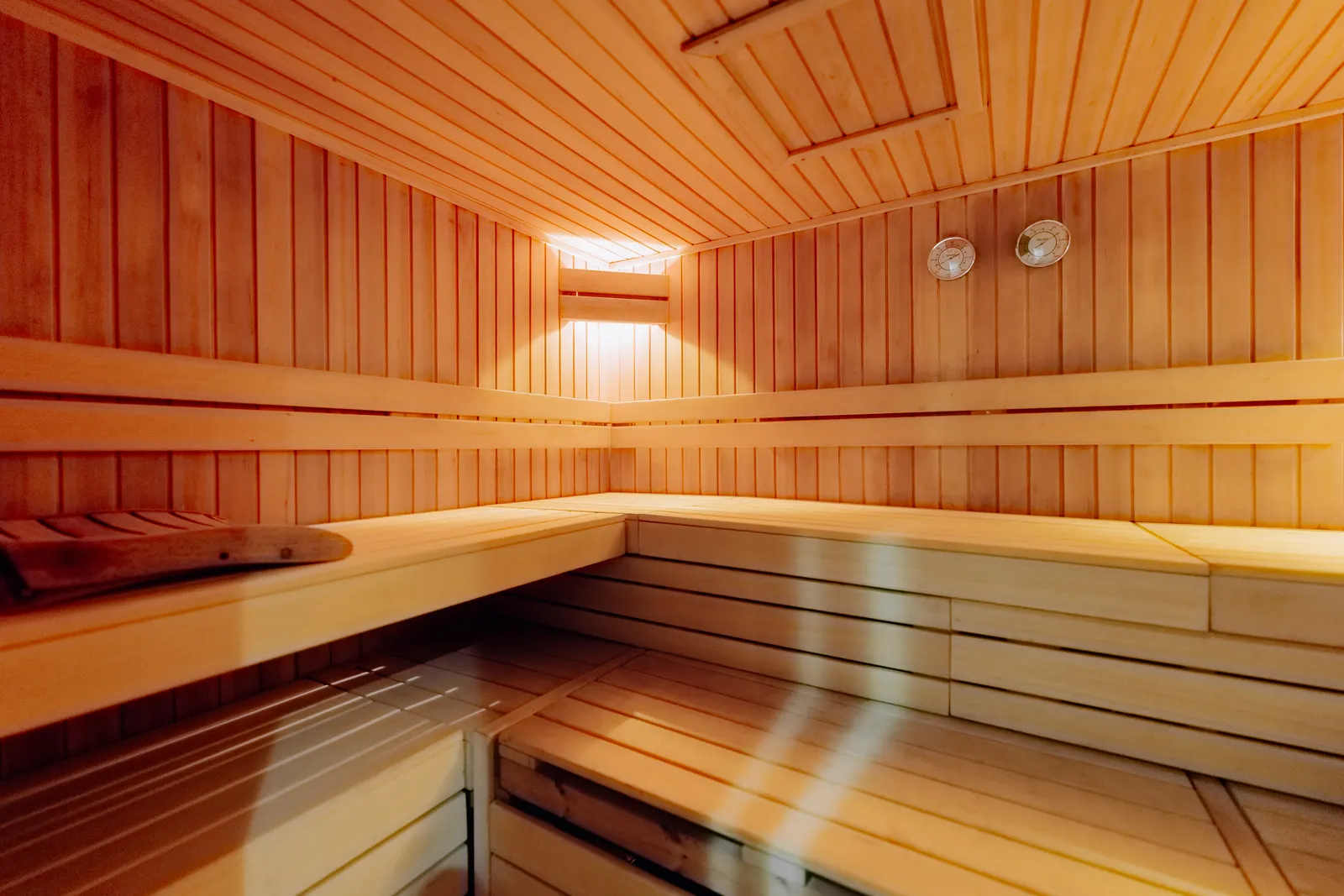 A cedar sauna with tiered benches.