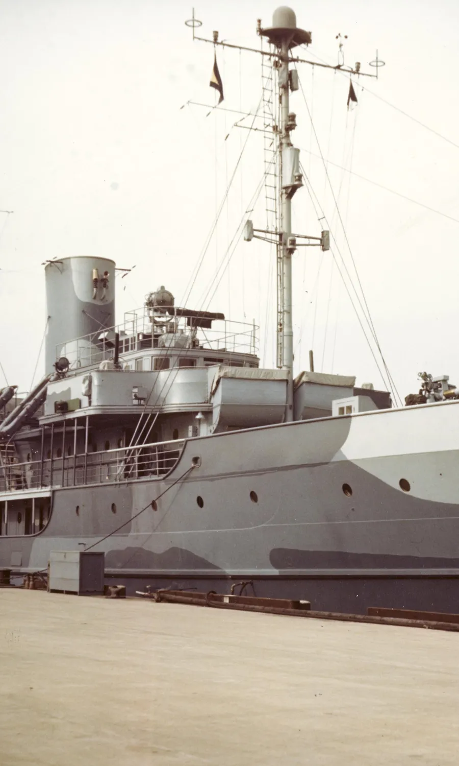 SS Delphine as USS Dauntless in wartime camouflage at the Washington Navy Yard, circa 1944 to 1945. US Navy photograph 80-G-K-14448, Naval History and Heritage Command. Public domain.