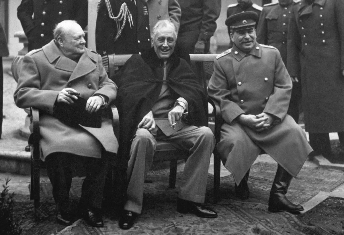 Winston Churchill, Franklin D. Roosevelt and Joseph Stalin seated at the Yalta Conference, February 1945. US Government photograph, public domain, via Wikimedia Commons.